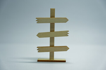 Wooden signpost with three horizontal arrows right left right