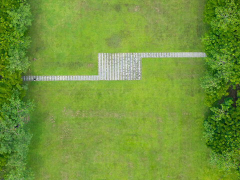 Aerial Stone Pathway in Green Field Drone Photography
