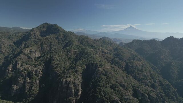 Aerial view of the Popocat&eacute;petl volcano in Mexico, seen from beautiful meadows. Mountains and volcanoes of Mexico, travel and vacation concept, 4k nature.

