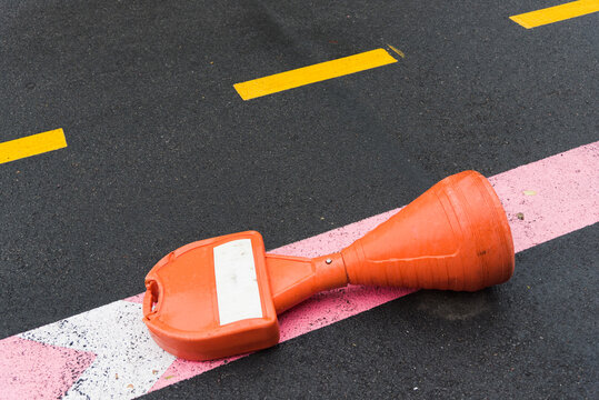 Rainy Street with Yellow Diagonals and Red Line