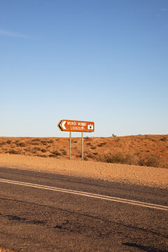 Early ssunset with sign at Mundi Mundi Lookout