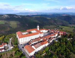 An aerial drone shot of a village with traditional houses, representing themes of travel, rural communities, and landscapes.
