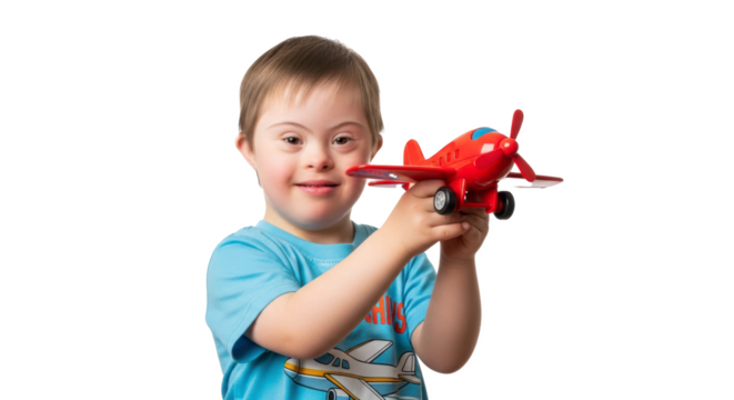A smiling boy with down syndrome holding a red toy airplane in front of a black background smiling happy - Powered by Adobe
