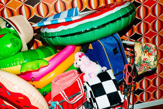 shopping cart holding a variety of summer objects