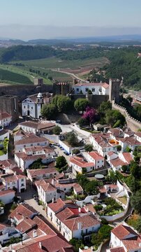 The medieval village of Obidos in Portugal.
Obidos sits on a hill surrounded by fortified walls. It's a famous place and tourist destination in Portugal. 4k.