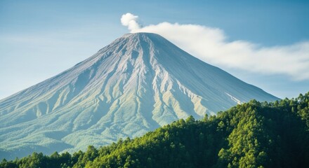 Fototapeta premium A beautiful view of a majestic stratovolcano with a plume of steam rising from its peak.