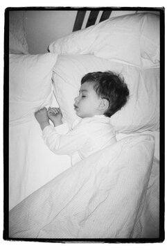 Cute Todler Is Sleeping In His Bed