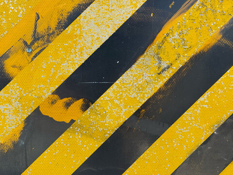 Striking Diagonal Patterns of Black and Yellow Caution Paint