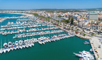 Obraz premium Aerial view of port of Alghero, a fortified city founded by the Genoese on the northwestern coast of Sardinia, an Italian island in the Mediterranean Sea