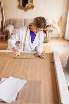Fashion designer drafting garment patterns
