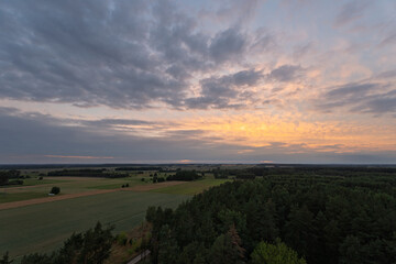 A beautiful sunset over a field of trees