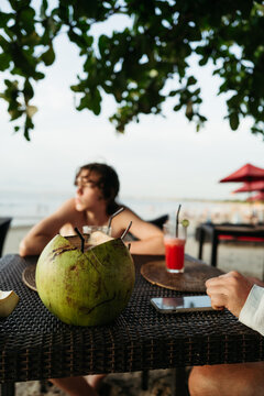 Beach Relaxation With Drinks and Coconuts
