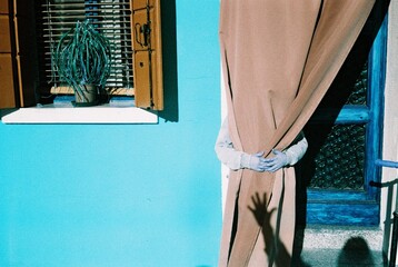 shadow hand on a Colorful houses in Venice