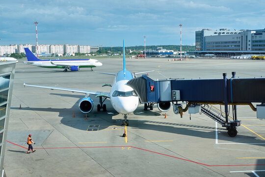 Airplanes parked at an airport terminal