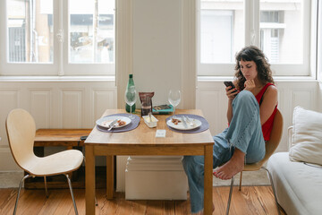 young woman finished meal in her apartment
