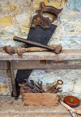 Vintage woodworking tools against a wall