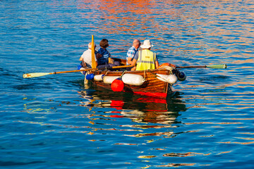 Naklejka premium Rowing passengers across water in Weymouth, England