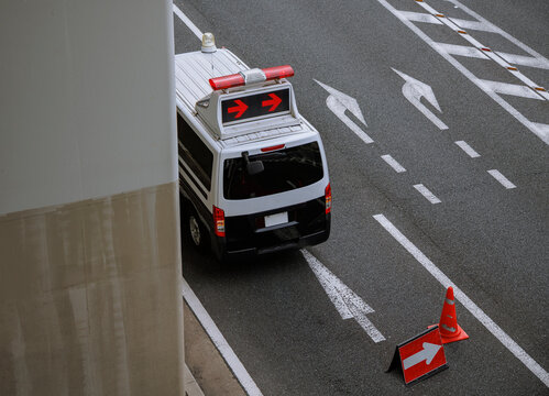 A glimpse of the city: Police car and traffic signs.