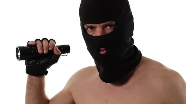 Intruder in Black Ski Mask and Gloves Holding Flashlight and Crowbar on White Background