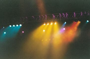 Overhead concert lights creating atmosphere before the performance