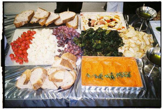 Film photo taken with direct flash capturing a catering table