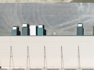 Warehouse Loading Dock with Trucks Aerial View