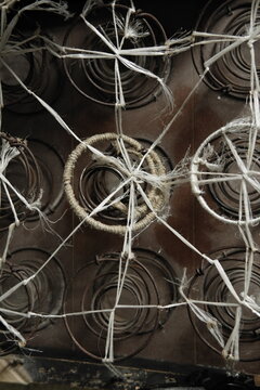 Close-up of Mattress Springs and Twine Web
