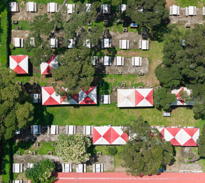 Outdoor BBQ Picnic Area Aerial View Red White Tents - Powered by Adobe