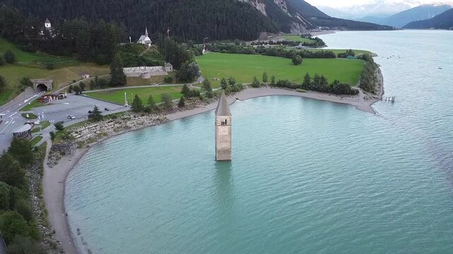 The iconic submerged Church Tower of Graun, Lake Reschensee, Italy 