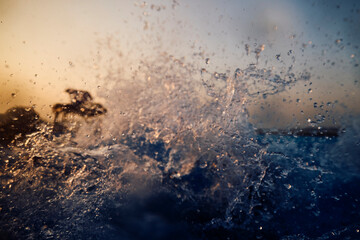 Water splashes at sunset