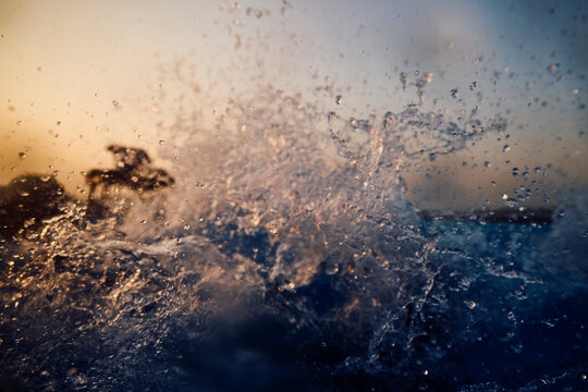 Water splashes at sunset
