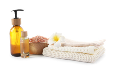 Spa composition with waffle towels and cosmetic products isolated on white