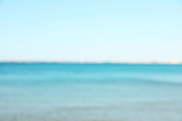 Beautiful sea under light blue sky, blurred view