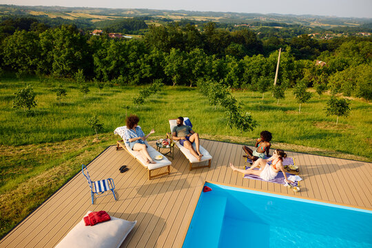 Friends are hanging out by the pool