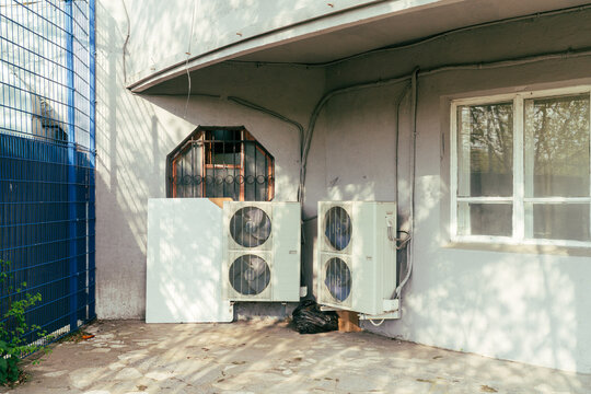 Dual Outdoor Air Conditioning Units on Building Wall
