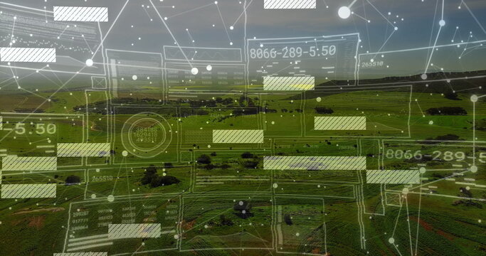 Fototapeta Projecting network overlay over farmland hills at dusk, with translucent grids, nodes and readouts