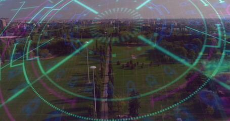 Overlaying HUD graphics across aerial park promenade, with lamp posts, trees and skyline