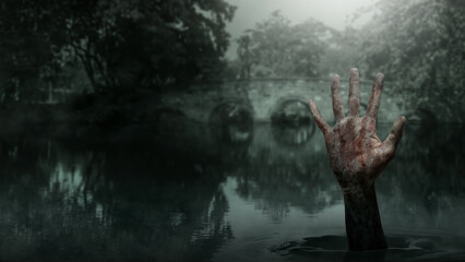Obraz premium Zombie hand with bloody wound rising out of the lake with a night scene background. Hand appearing to be a devil, evil, satan, or a monster hand. Concept of Spooky Halloween