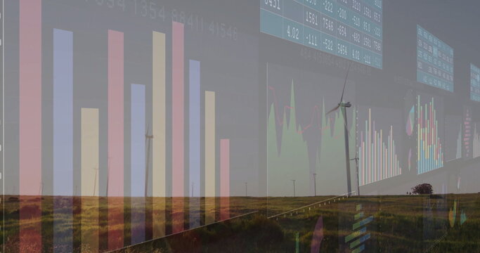 Displaying wind turbines on grassy plain under digital bar charts, line graphs and numeric tables - Powered by Adobe