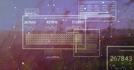 Projecting holographic keyboard grid, numeric panels and network nodes over blurry treeline at dusk