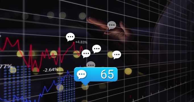 Reaching adult hand manipulating virtual data interface at office, with line charts, chat bubbles