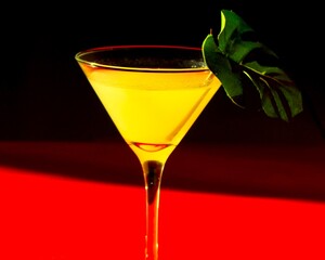 red cocktail on black background
