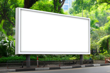 Fototapeta premium Blank White Billboard Standing Outdoors in Green Urban Park Setting. Mock up promotion information for marketing announcements and details, blank white space.