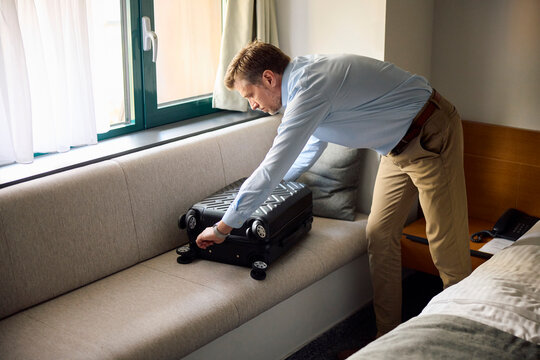 Businessman unpacks his belongings