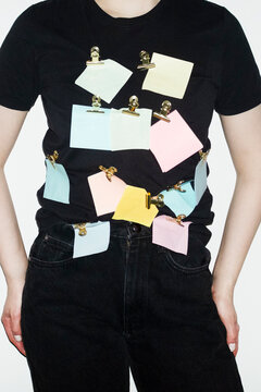 Person having post it notes in the shirt in business office with flash