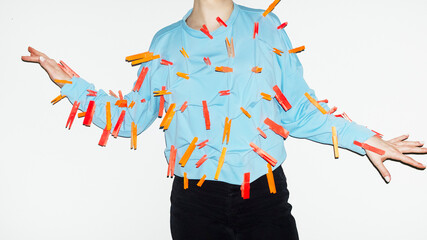 Person with colourful laundry boys in their blue shirt with flashlight