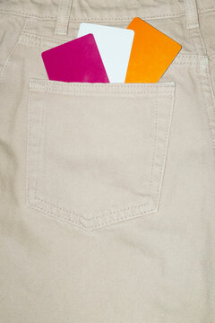 Credit debit payment money cards in pocket of brown denim jeans 