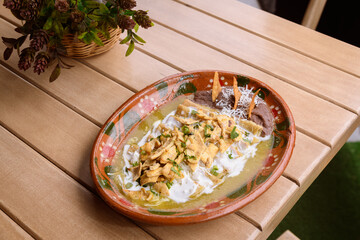 Green chilaquiles with chicken