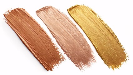 Three makeup swatches of bronze copper rose gold and gold metallic cream isolated on white background