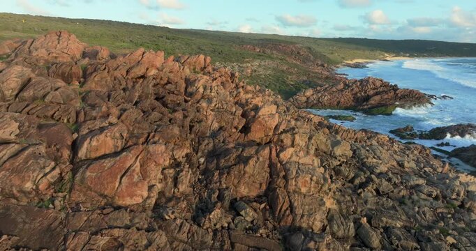 4k Aerial views of rugged rocky coastline in South West Australia at sunset